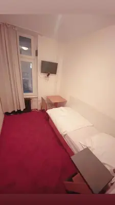 Ein Bett oder Betten in einem Zimmer der Unterkunft Märkischer Hof Hotel