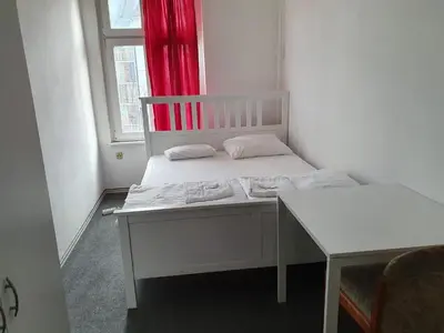 Ein Bett oder Betten in einem Zimmer der Unterkunft Märkischer Hof Hotel