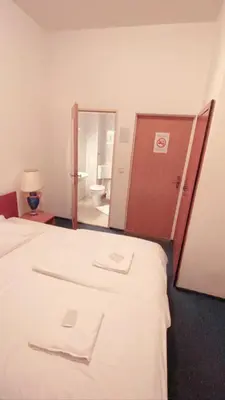 Ein Bett oder Betten in einem Zimmer der Unterkunft Märkischer Hof Hotel