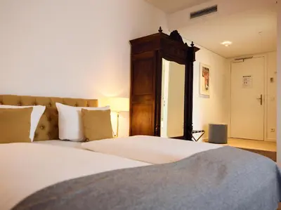 Ein Bett oder Betten in einem Zimmer der Unterkunft Hotel Lindenufer
