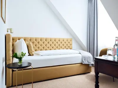 Ein Bett oder Betten in einem Zimmer der Unterkunft Hotel Lindenufer