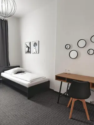 Ein Bett oder Betten in einem Zimmer der Unterkunft Hotel AVAlex