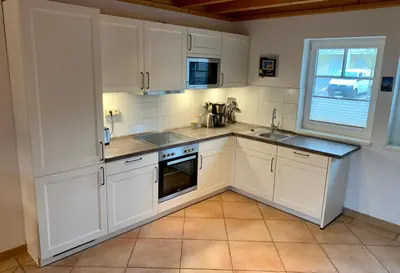 Küche/Küchenzeile in der Unterkunft Ferienhaus mit Bootssteg am See in Rheinsberg