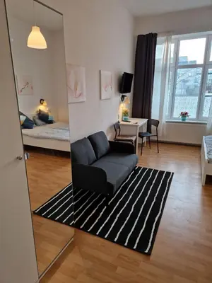 Ein Sitzbereich in der Unterkunft Zimmervermietung Berlin Mertens
