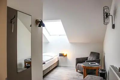 Ein Bett oder Betten in einem Zimmer der Unterkunft PRIMA Inn Unterkunft direkt über der 