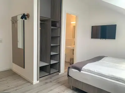 Ein Bett oder Betten in einem Zimmer der Unterkunft PRIMA Inn Unterkunft direkt über der 