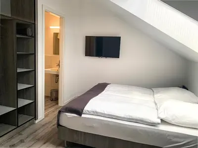 Ein Bett oder Betten in einem Zimmer der Unterkunft PRIMA Inn Unterkunft direkt über der 