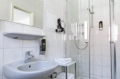 Ein Badezimmer in der Unterkunft Aparthotel VEGA