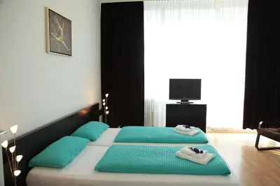 Ein Bett oder Betten in einem Zimmer der Unterkunft Aparthotel VEGA