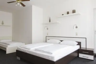 Ein Bett oder Betten in einem Zimmer der Unterkunft Aparthotel VEGA