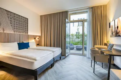 Ein Bett oder Betten in einem Zimmer der Unterkunft Citadines Kurfürstendamm Berlin