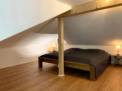 Ein Bett oder Betten in einem Zimmer der Unterkunft Ferienwohnung im Stadtzentrum