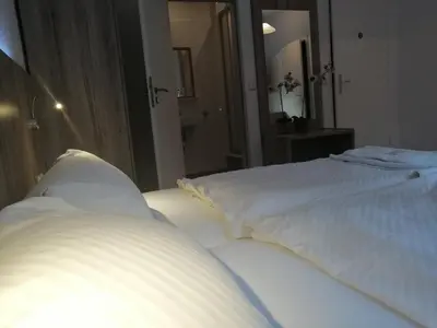 Ein Bett oder Betten in einem Zimmer der Unterkunft Pension Der Kretaner