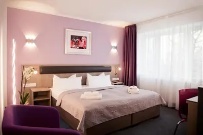Ein Bett oder Betten in einem Zimmer der Unterkunft Hotel Nikolai Residence