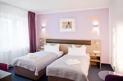 Ein Bett oder Betten in einem Zimmer der Unterkunft Hotel Nikolai Residence