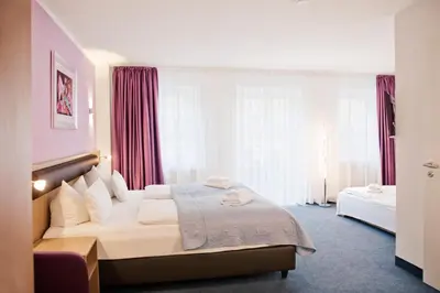 Ein Bett oder Betten in einem Zimmer der Unterkunft Hotel Nikolai Residence