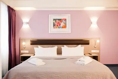 Ein Bett oder Betten in einem Zimmer der Unterkunft Hotel Nikolai Residence