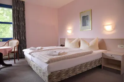 Ein Bett oder Betten in einem Zimmer der Unterkunft HOTEL-RESTAURANT-SPITZKRUG