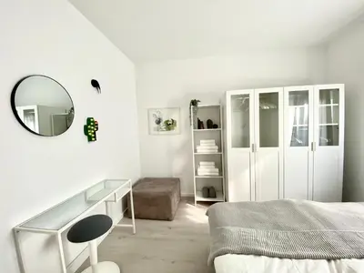 Ein Bett oder Betten in einem Zimmer der Unterkunft modernes Apartment, Terrasse und Garten am Lilienthalpark im Südwesten Berlins
