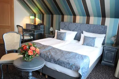 Ein Bett oder Betten in einem Zimmer der Unterkunft Hotel Linther Hof