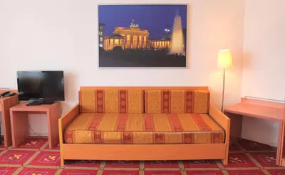 Ein Sitzbereich in der Unterkunft Hotel Kaiser