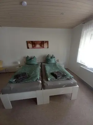 Ein Bett oder Betten in einem Zimmer der Unterkunft Quartier 6
