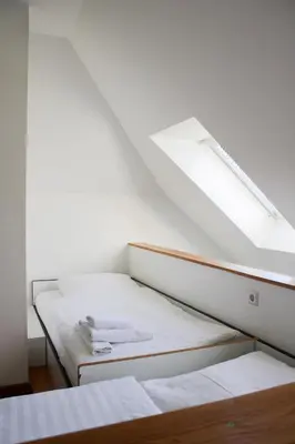 Ein Bett oder Betten in einem Zimmer der Unterkunft GLS Studio Hotel Berlin