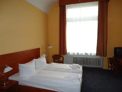 Ein Bett oder Betten in einem Zimmer der Unterkunft City Hotel am Kurfürstendamm