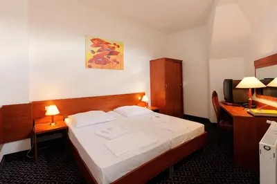 Ein Bett oder Betten in einem Zimmer der Unterkunft City Hotel am Kurfürstendamm