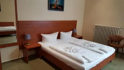 Ein Bett oder Betten in einem Zimmer der Unterkunft City Hotel am Kurfürstendamm