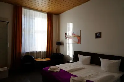Ein Bett oder Betten in einem Zimmer der Unterkunft Hotel Margrit