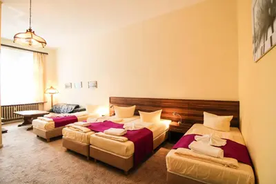 Ein Bett oder Betten in einem Zimmer der Unterkunft Hotel Margrit