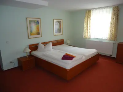 Ein Bett oder Betten in einem Zimmer der Unterkunft PP Pension Potsdam
