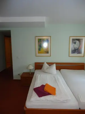 Ein Bett oder Betten in einem Zimmer der Unterkunft PP Pension Potsdam