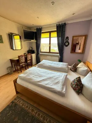 Ein Bett oder Betten in einem Zimmer der Unterkunft Pension am Tiefen See