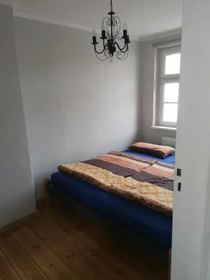 Ein Bett oder Betten in einem Zimmer der Unterkunft Ferienhaus Elstal