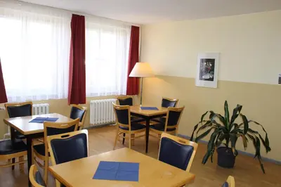 Ein Sitzbereich in der Unterkunft Pension Schwalbenweg