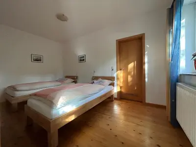 Ein Bett oder Betten in einem Zimmer der Unterkunft Ferienwohnung Mayer