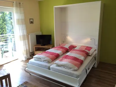 Ein Bett oder Betten in einem Zimmer der Unterkunft Ferienwohnung Mayer
