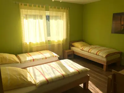 Ein Bett oder Betten in einem Zimmer der Unterkunft Ferienwohnung Mayer