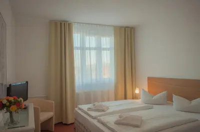 Ein Bett oder Betten in einem Zimmer der Unterkunft Apart Hotel Ferdinand Berlin