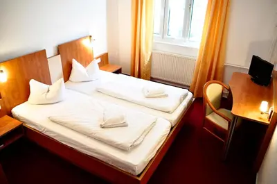 Ein Bett oder Betten in einem Zimmer der Unterkunft Apart Hotel Ferdinand Berlin