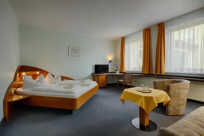 Ein Bett oder Betten in einem Zimmer der Unterkunft Hotel Sophienhof