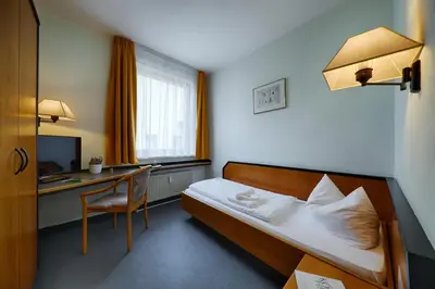 Ein Bett oder Betten in einem Zimmer der Unterkunft Hotel Sophienhof