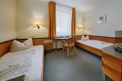 Ein Bett oder Betten in einem Zimmer der Unterkunft Hotel Sophienhof