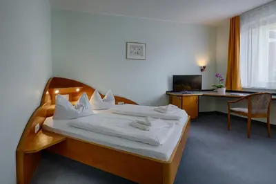 Ein Bett oder Betten in einem Zimmer der Unterkunft Hotel Sophienhof