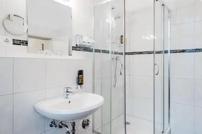 Ein Badezimmer in der Unterkunft Hotel-Pension Michele