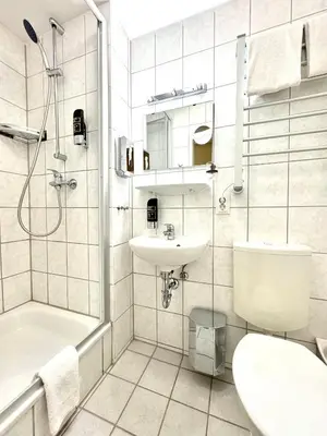 Ein Badezimmer in der Unterkunft Hotel-Pension Michele