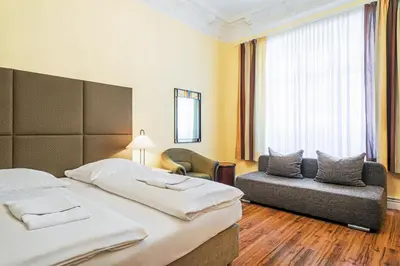 Ein Bett oder Betten in einem Zimmer der Unterkunft Hotel-Pension Michele