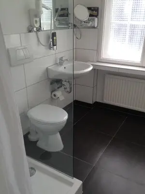 Ein Badezimmer in der Unterkunft Hotel Landhaus Schlachtensee